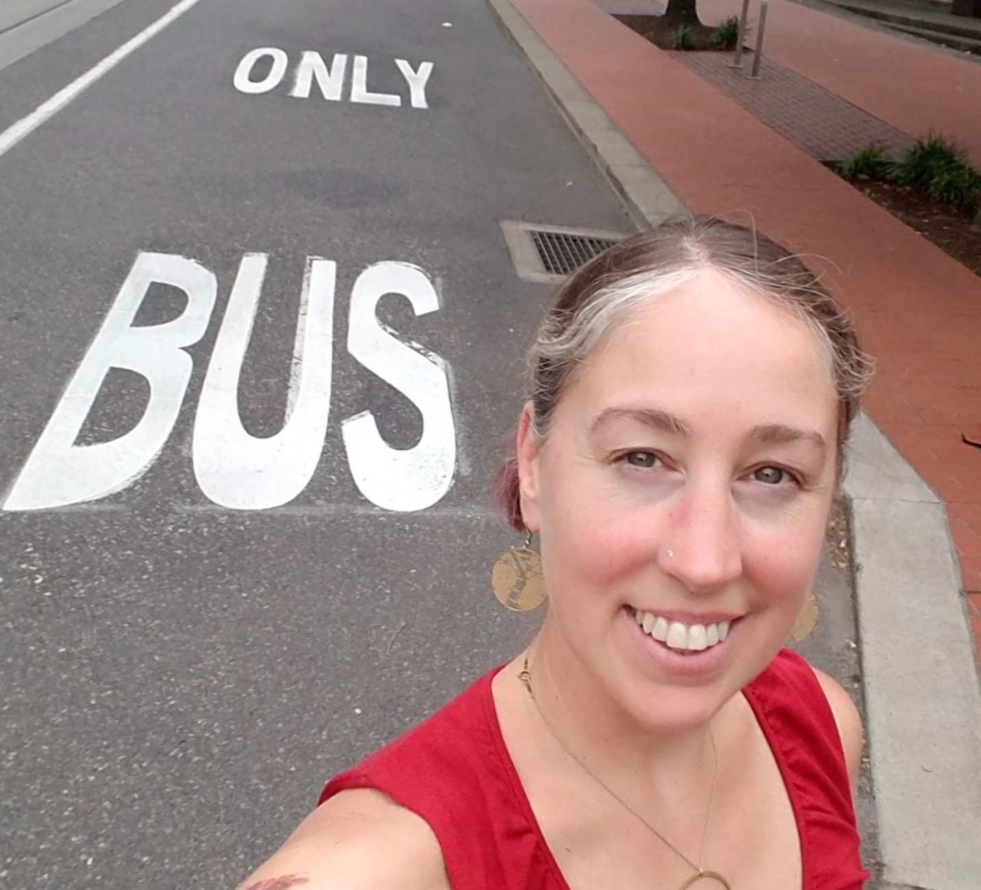 April Bertelson in front of a bus only lane