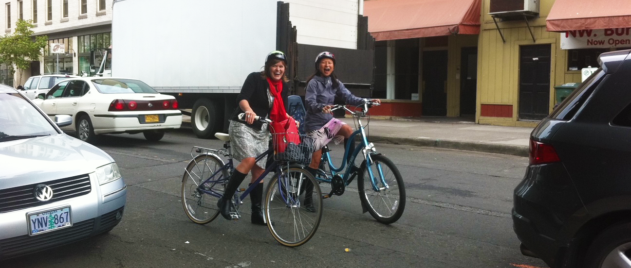 Two women on bikes, Hau Hagedorn and Kelly Clifton