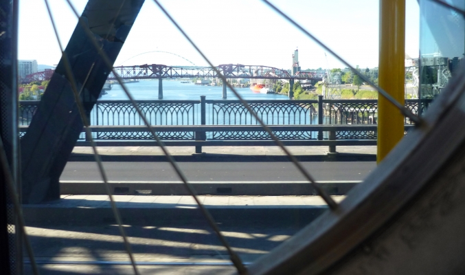 River_through_spokes_crop.jpg