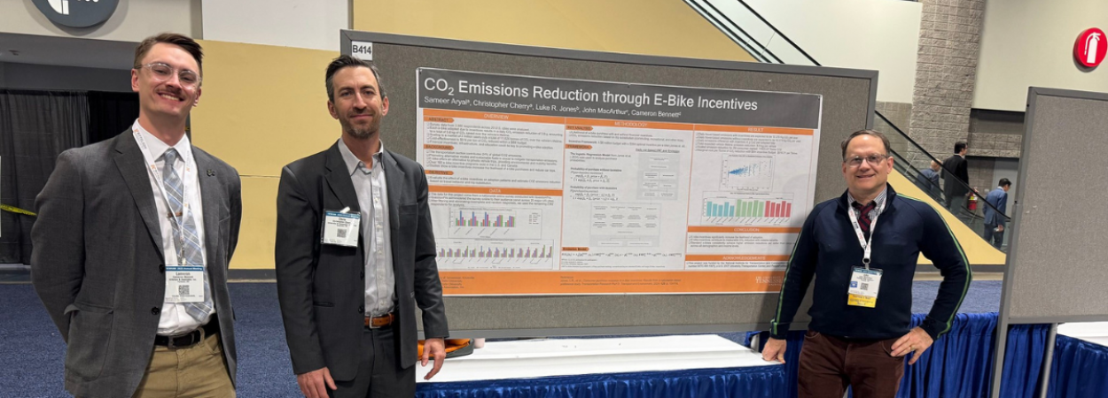 Cameron Bennett, Chris Cherry, and John MacArthur present a poster at TRB 2025