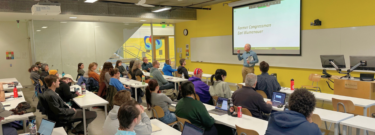 Former Congressman Earl Blumenauer presents to the 2026 Community Transportation Academy cohort. 