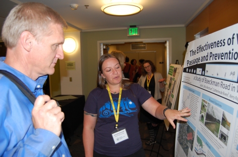 Leslie Bliss-Ketchum, a PSU doctoral student, explains her work on an OTREC research project dealing with under-road animal passages during a poster session at the Oregon Transportation Summit. The poster session was the first for the third annual summit.