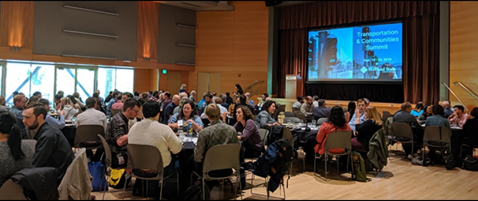 A view of the ballroom with attendees eating lunch during the Summit keynote